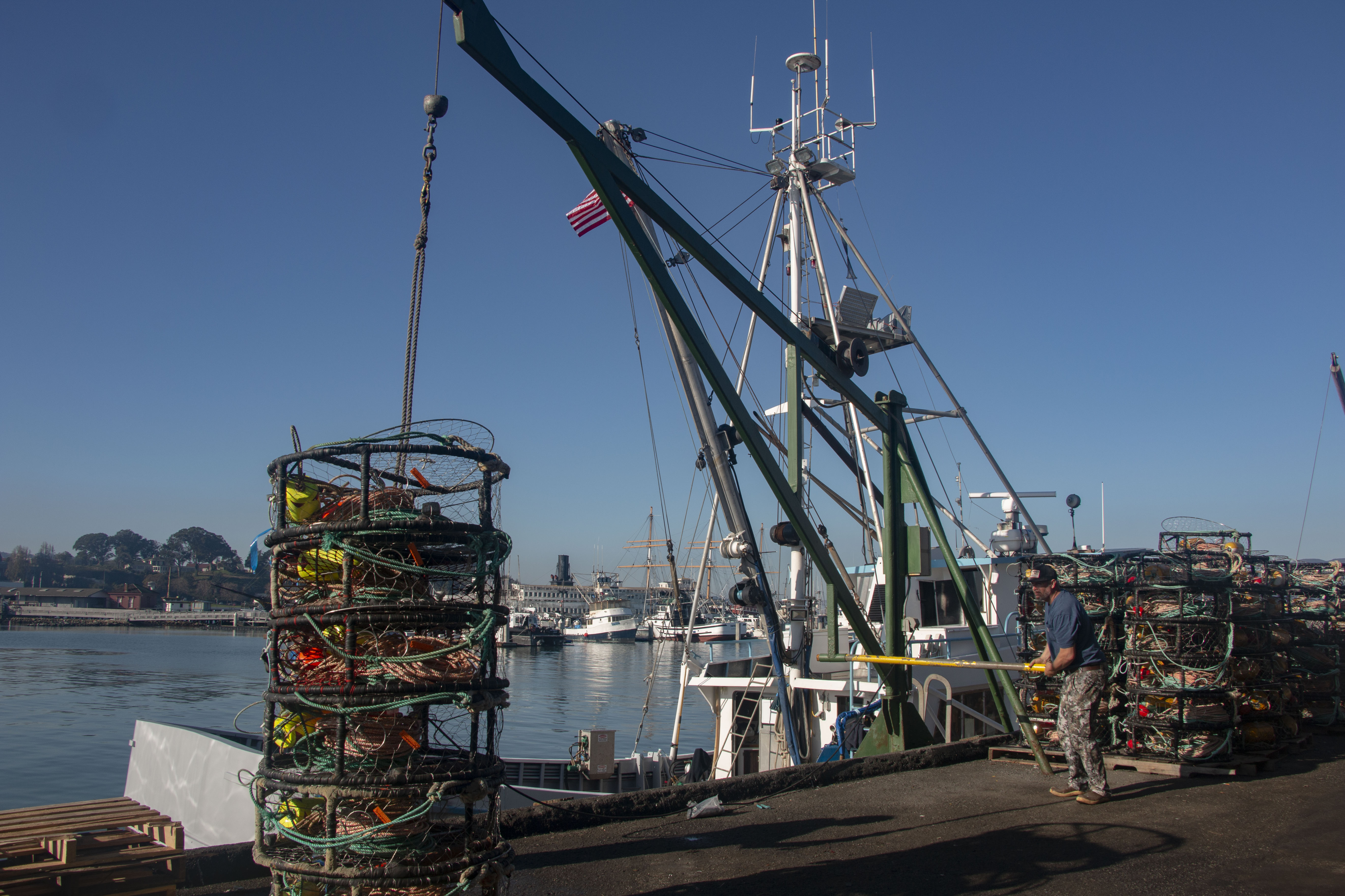 Workers are carrying traps to the ship