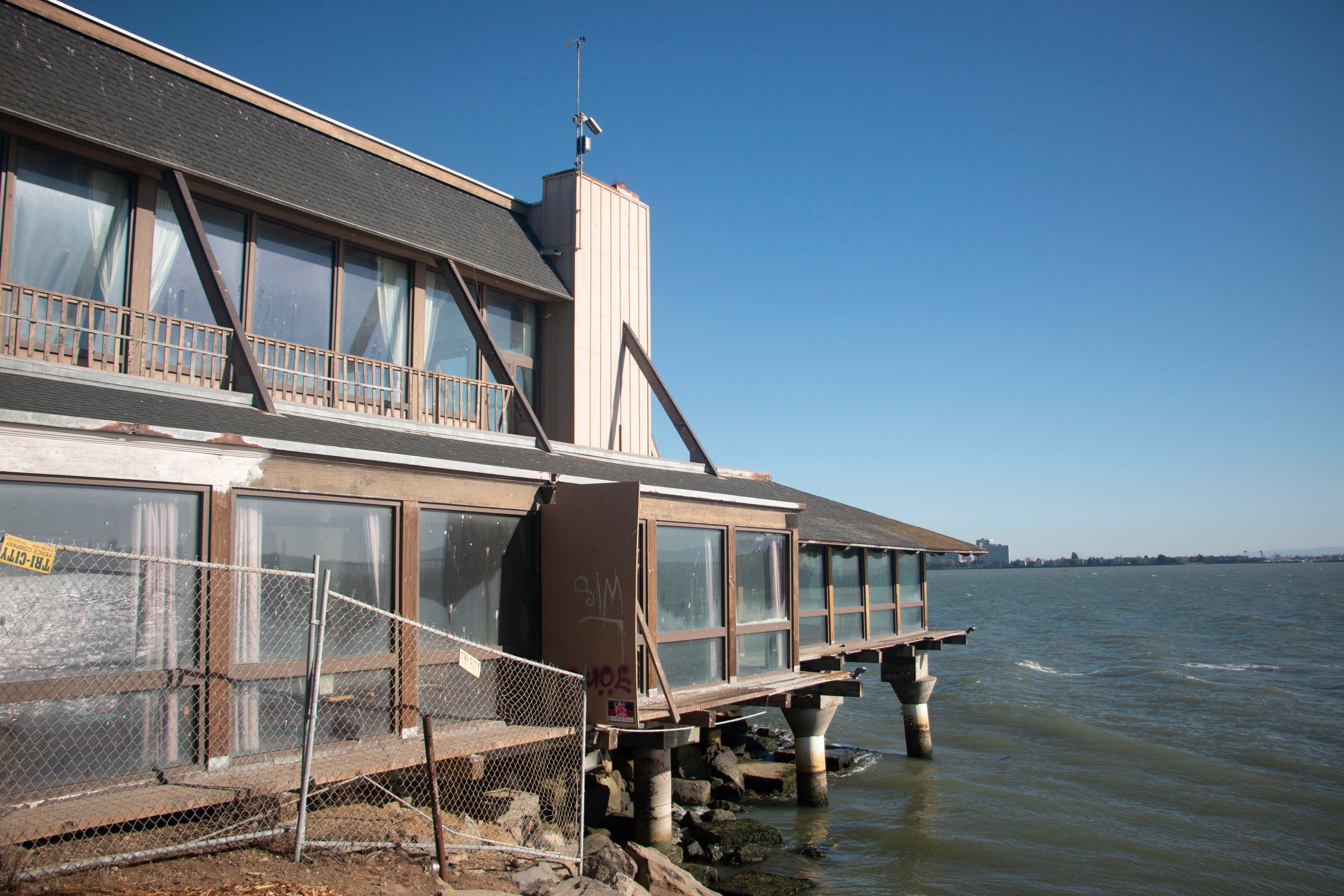 The building of the restaurant and the wind detector on the roof